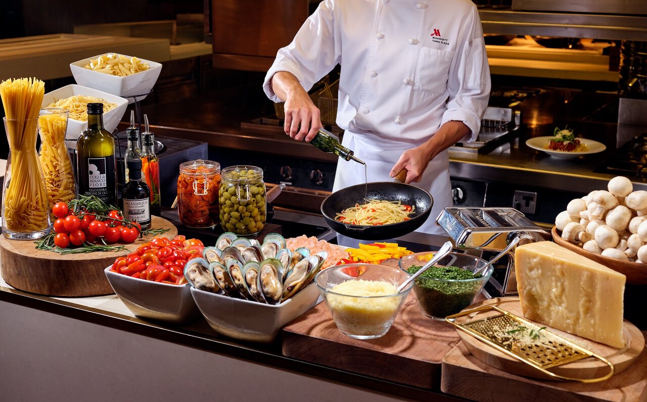Live food counter with chef preparing dishes